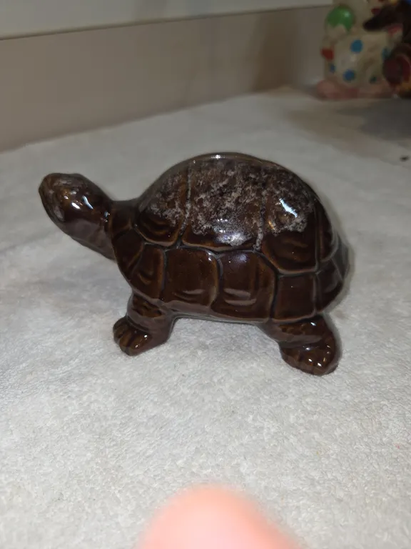 Vintage brown glazed ceramic turtle coinbank produced in Japan during the mid 20th century.