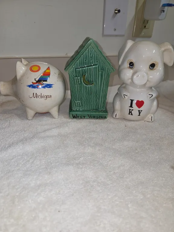 3 assorted ceramic souvenir coin banks