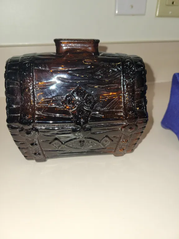 1950s Vintage Amber glass treasure, chest coinbank, and blue ceramic handmade coinbank, with a few c