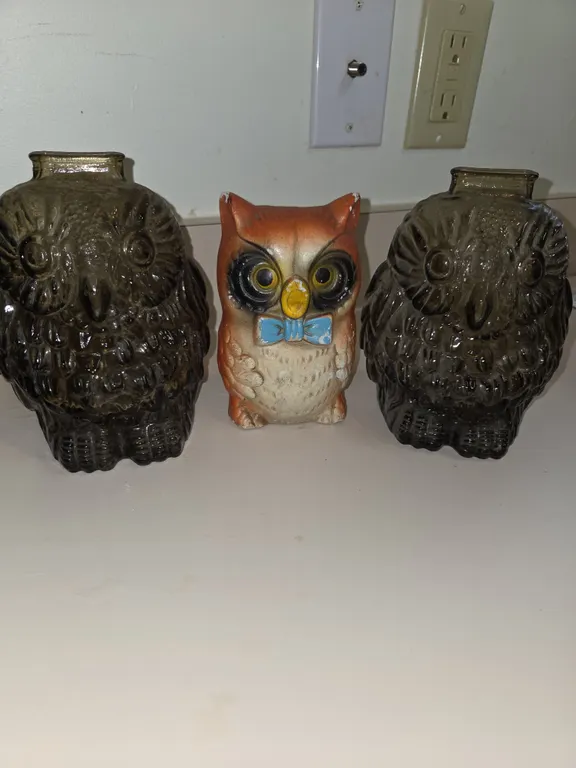 2 glass and one ceramic hand painted owl coinbanks.