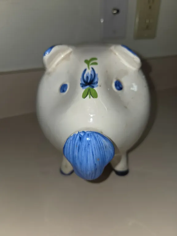Vintage ceramic, piggy bank with blue and green flowers.