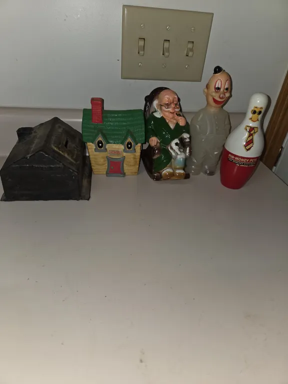 5 assorted glass metal ceramic and plastic coin banks.
