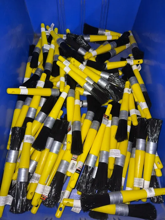 Bin of Plastic cleaning brushes