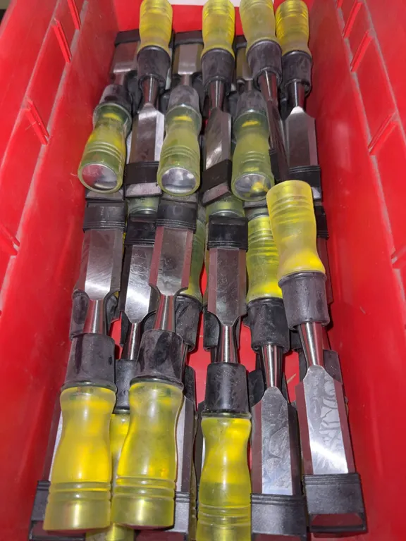 Bin of 1” new wood chisels