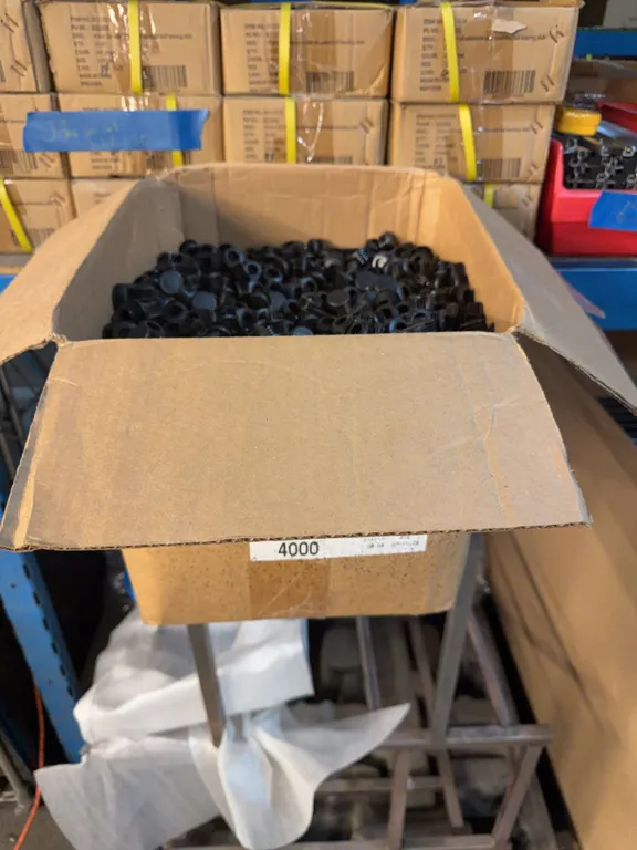 Box Full Of Black Round Caps