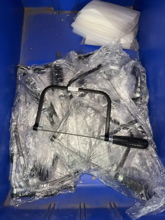 Bin of new 6” coping saws