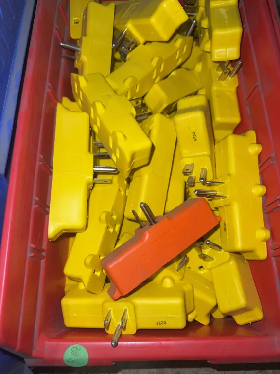 Bin of 3 to 1 multi plug adapters