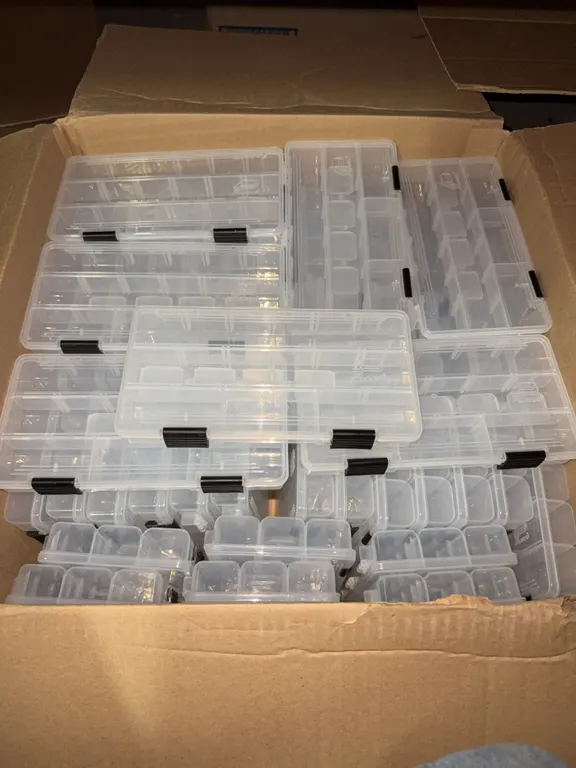 Box of small plastic organizers containers