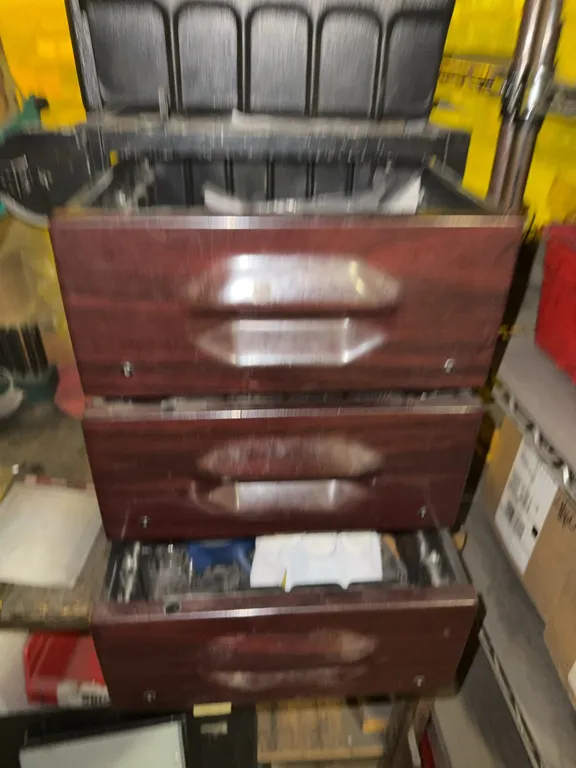Desk cabinet filled with tools