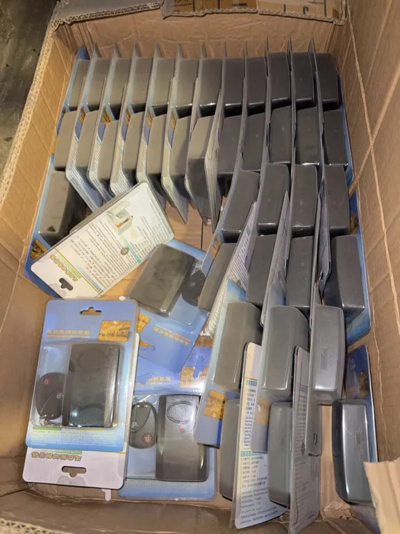Box of new remote, control, vibration, alarms with box of organizer pouches