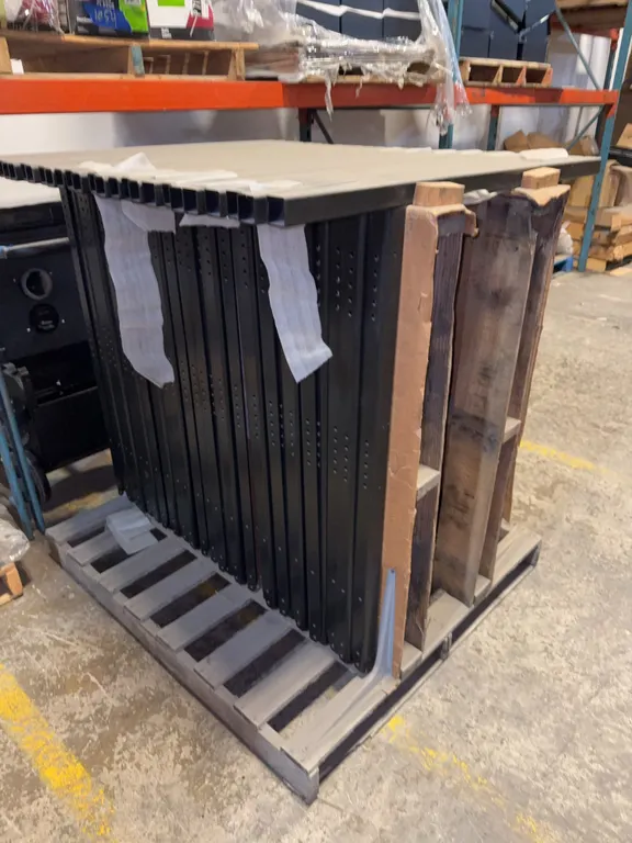 Pallet of black metal frames