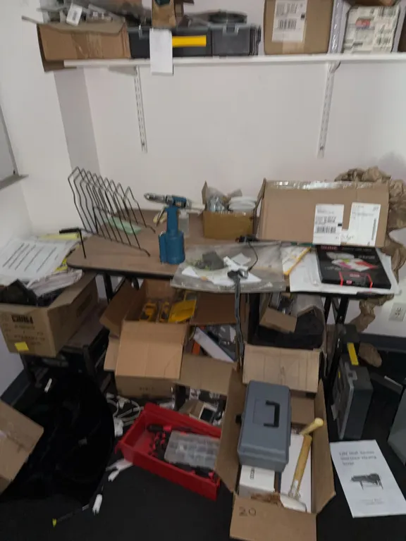 Miscellaneous tools on shelf and ground no papers included