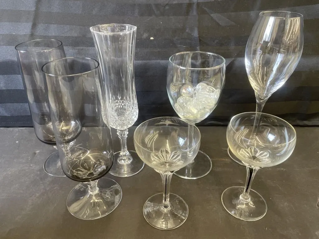 Assortment of more than a dozen wine glasses.