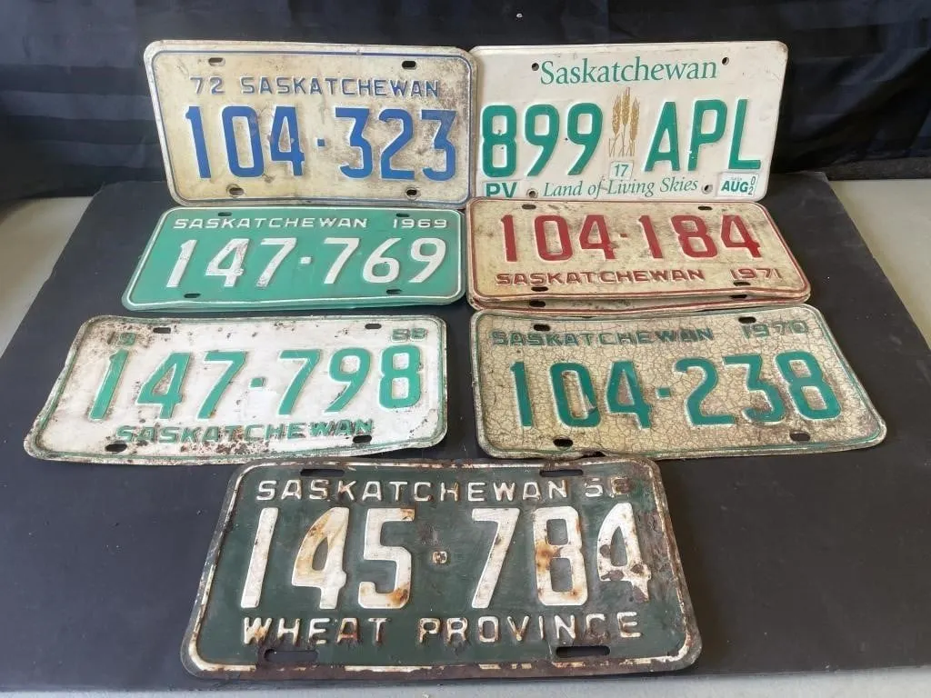 Four sets of vintage Saskatchewan vehicle licence