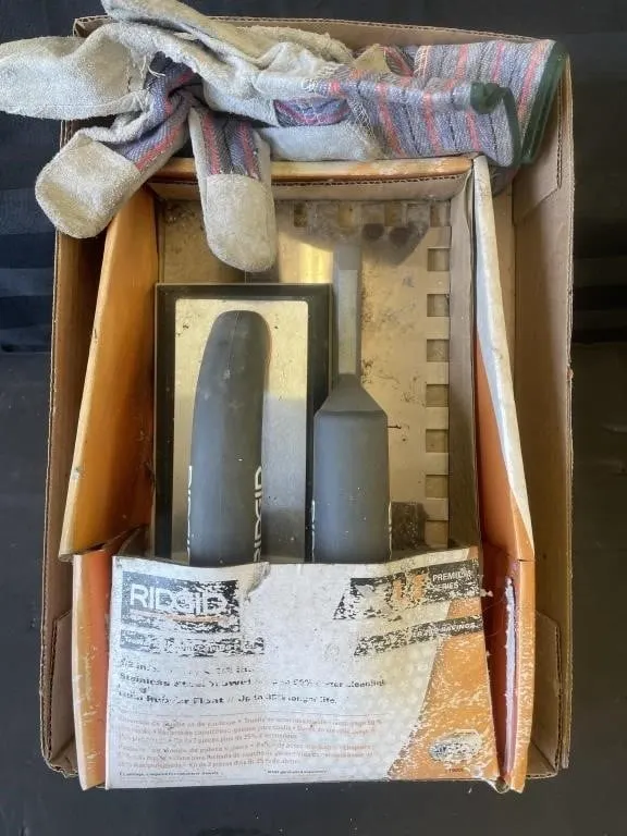 Pair of Ridgid stainless steel trowels and a pair