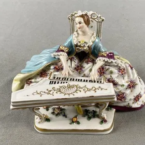 Lady Playing Piano Porcelain Figurine