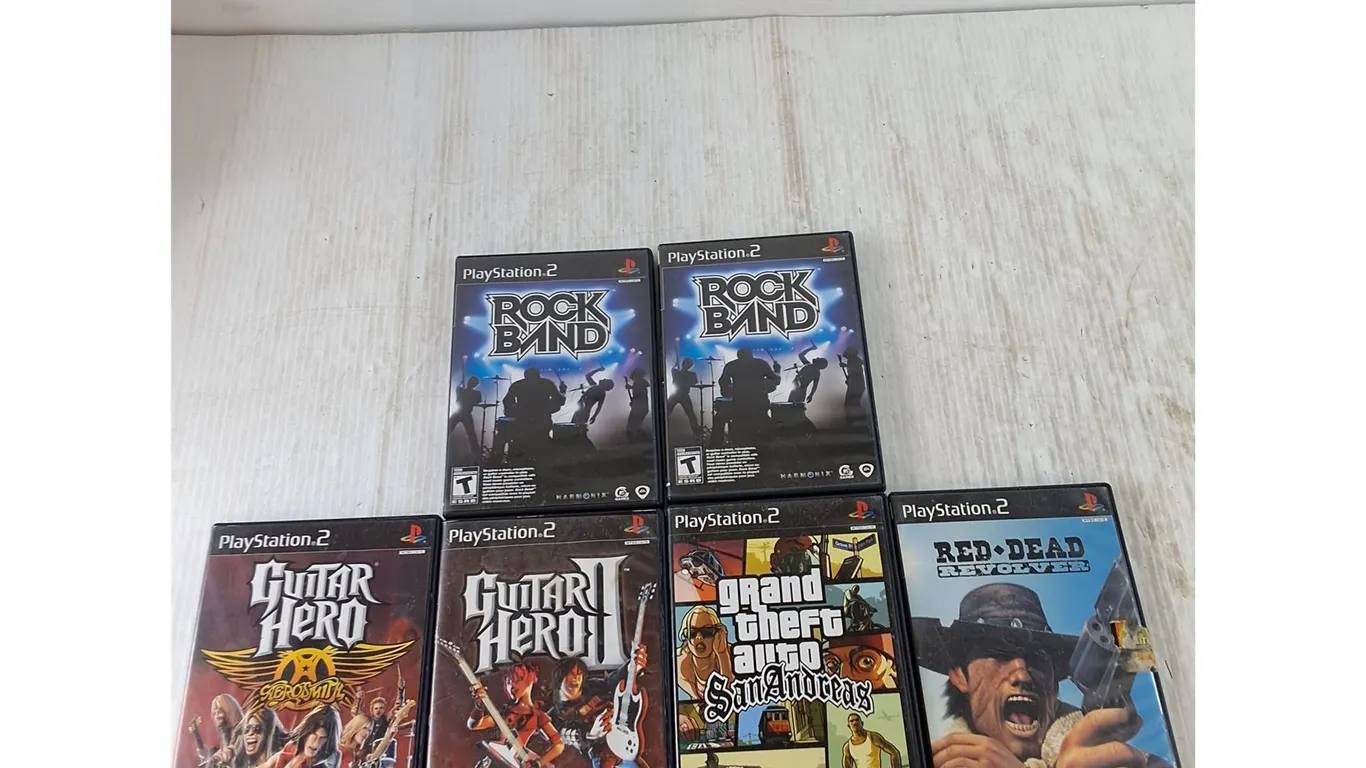 (6) PlayStation 2 Games, Rock Band Guitar Hero, San Andreas, Red Dead Revolver