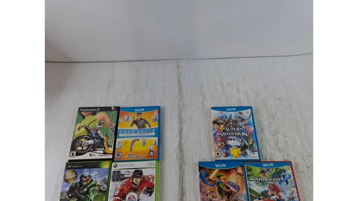 (3) WiiU Games, Zelda, Mario, Super Smash Bros, (4) Empty Game Cases No Disc