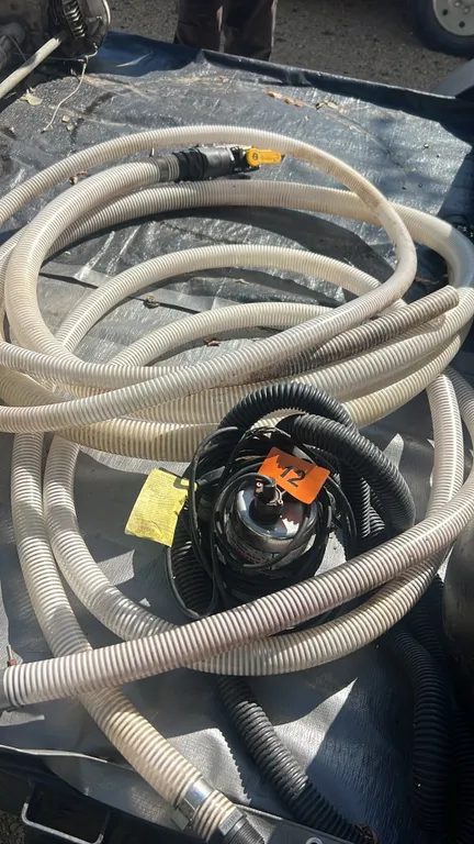 Sump pump with variety of hoses