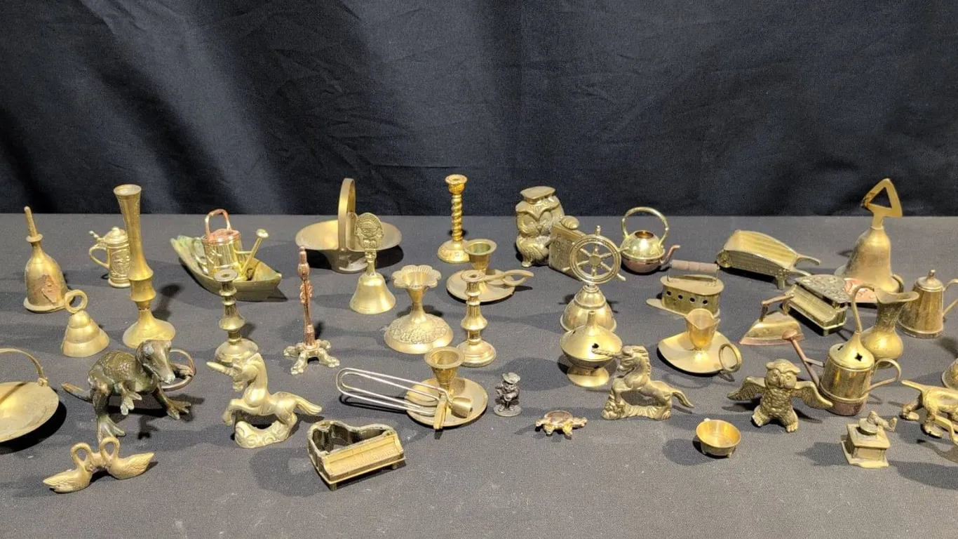 Brass Miniatures Including Animals, Candlesticks, Bells, Irons, and Trinkets