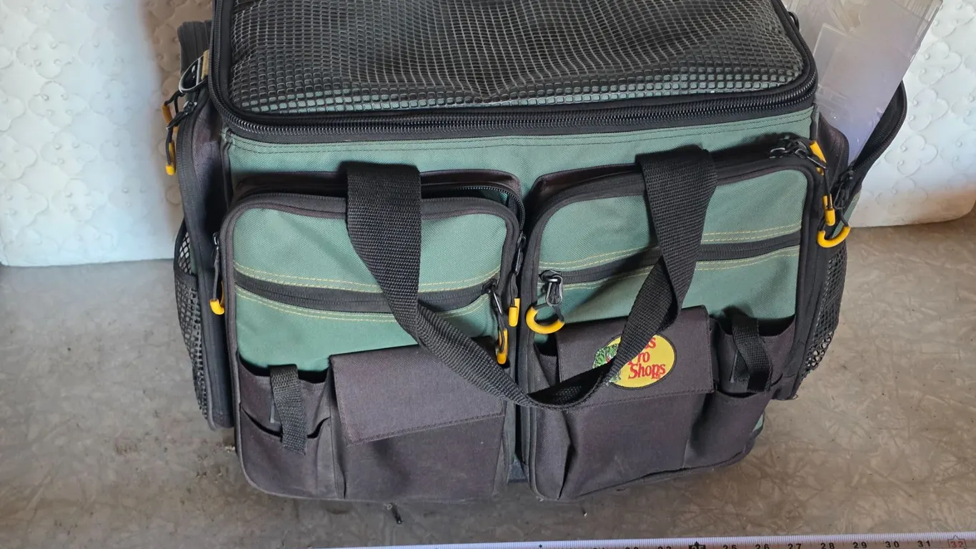 Large bass pro fishing tackle box with fishing lures