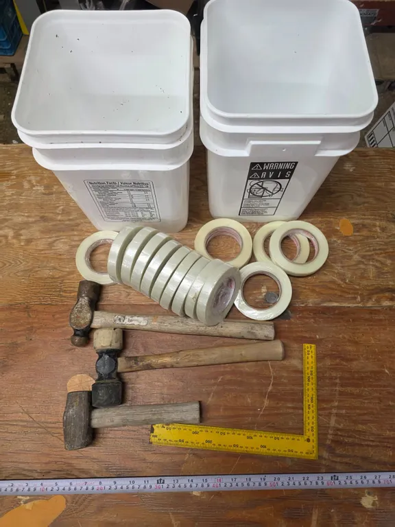 Lot of tools, hammers, tape, bucket