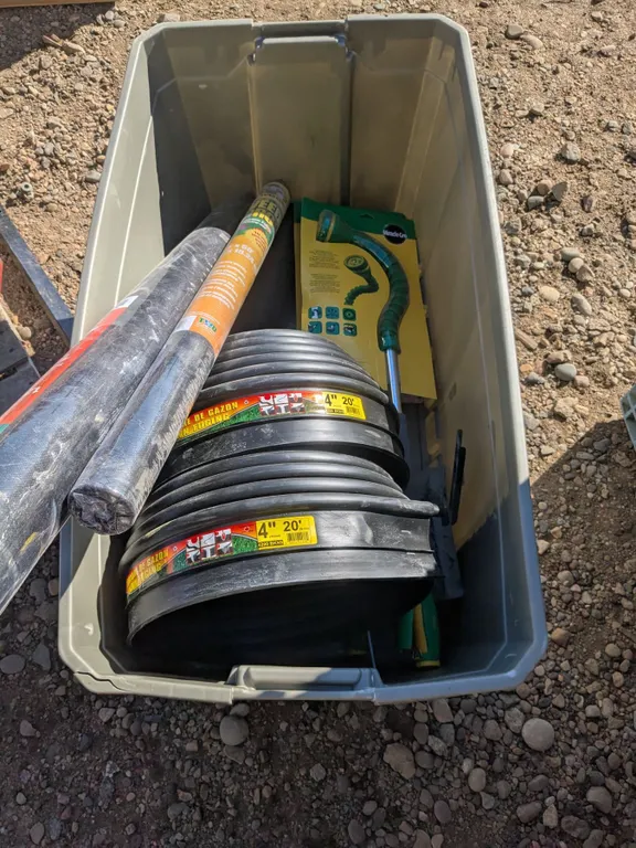 Large Tote of NOS Landscape Supplies – Edging, Landscape Fabric, Watering Wands