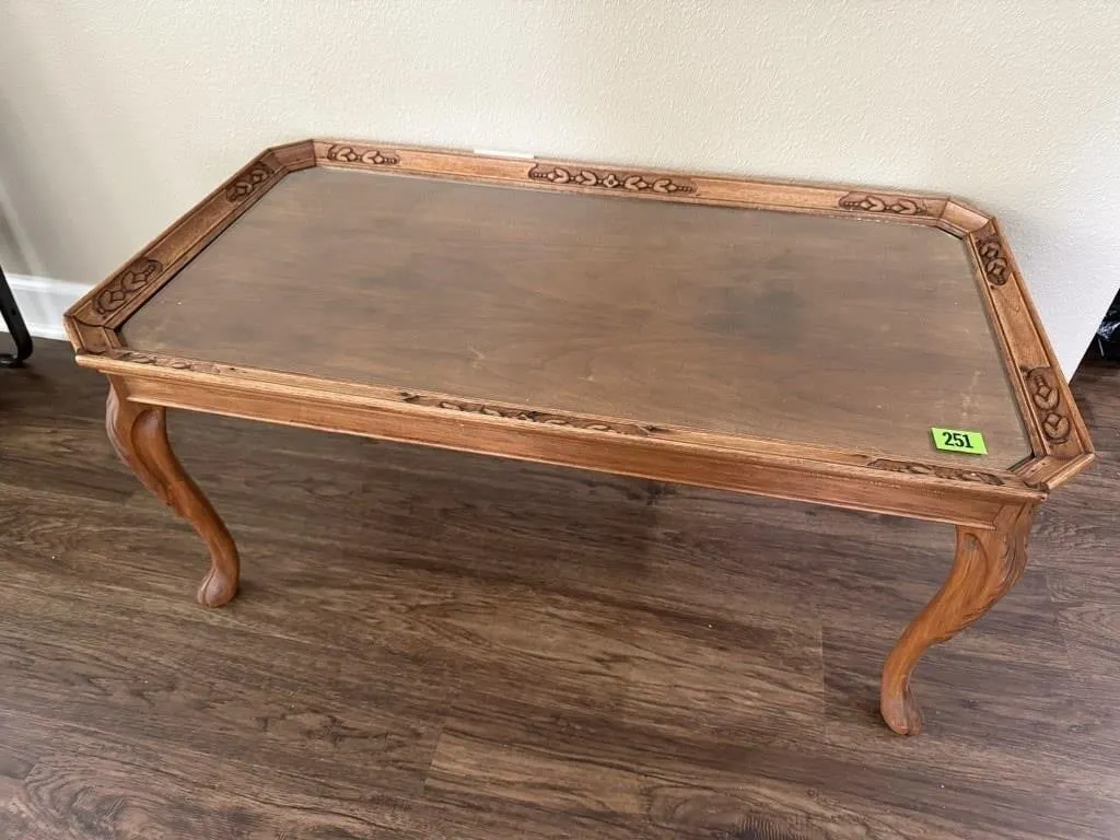 Wood carved glass top coffee table