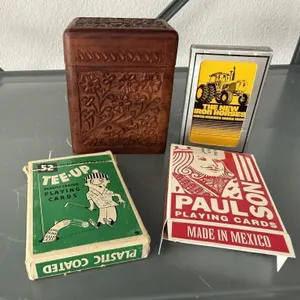 Assorted playing cards, wood carved card box