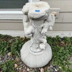Concrete squirrel bird bath