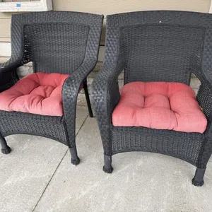 Black wicker patio chairs (2), cushions