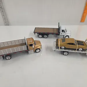 3 - 1/32? Semi Trucks - International 4200 Tilt Deck, Peterbilt 335 Tilt Deck w/ Dodge Charger & Freightliner M2 Stake Truck