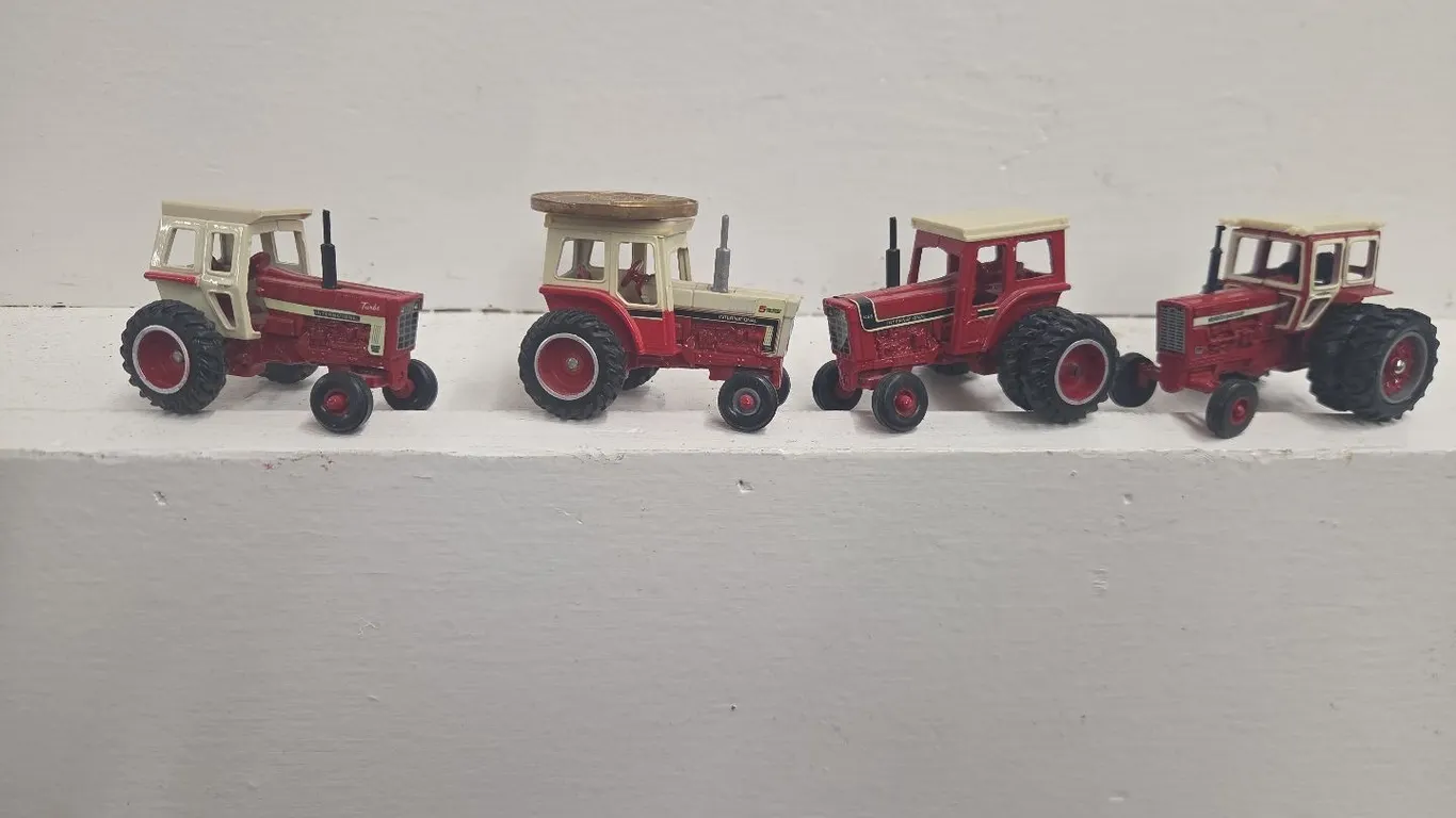 4 - 1/64 IH Tractors, 1066 Turbo, 1466, 856 w/ Hiniker Cab, & 1066 5 Millionth w/ coin