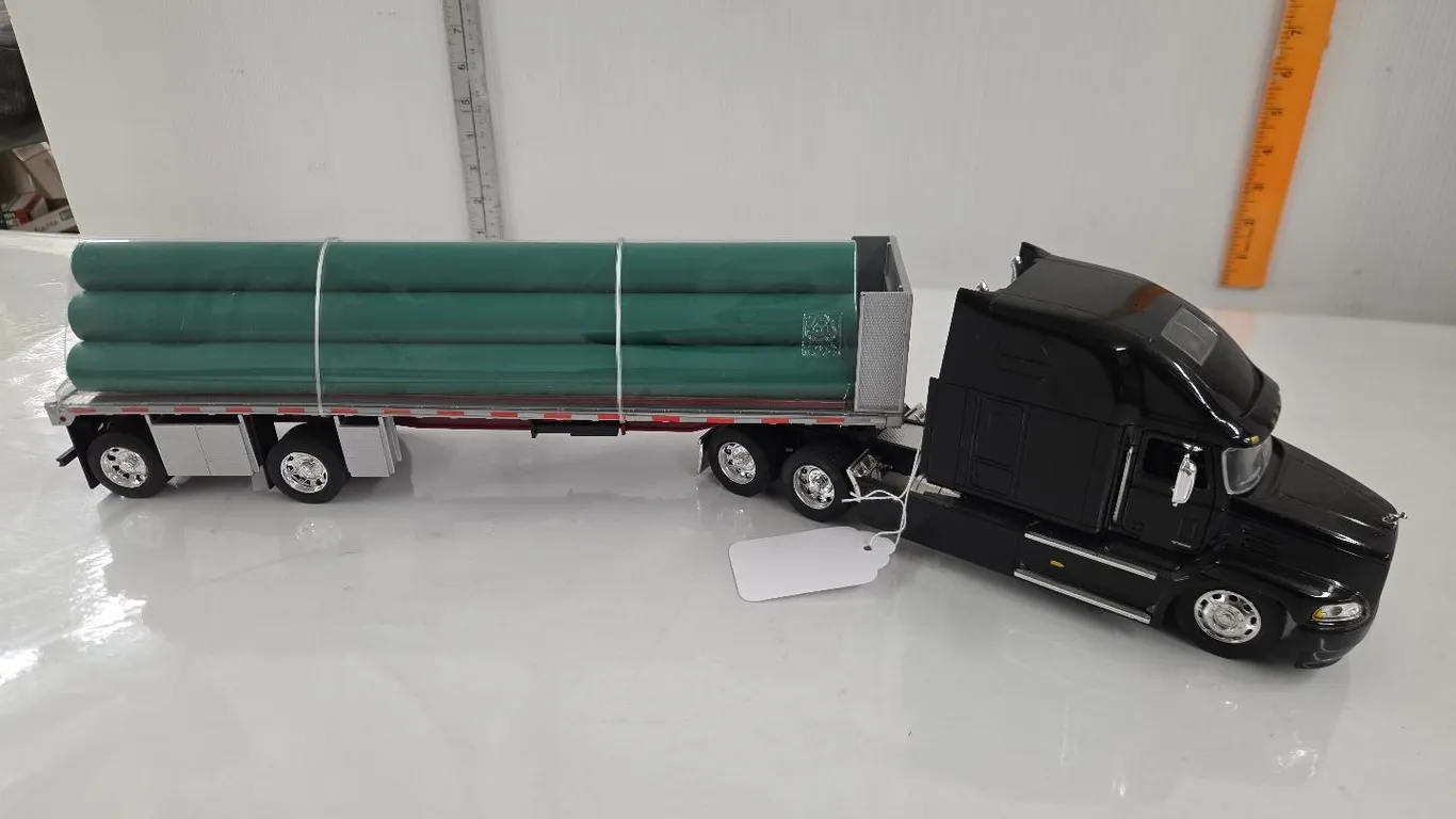 1/32 Mack Vision Semi w/ Flat Deck hauling Pipe