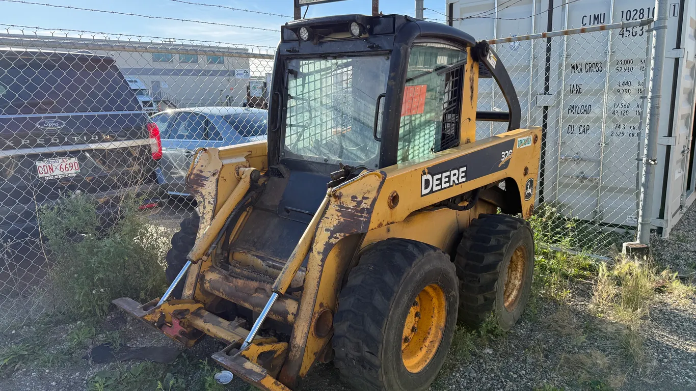 John Deere 320 Skid Steer w/ Pallet Forks