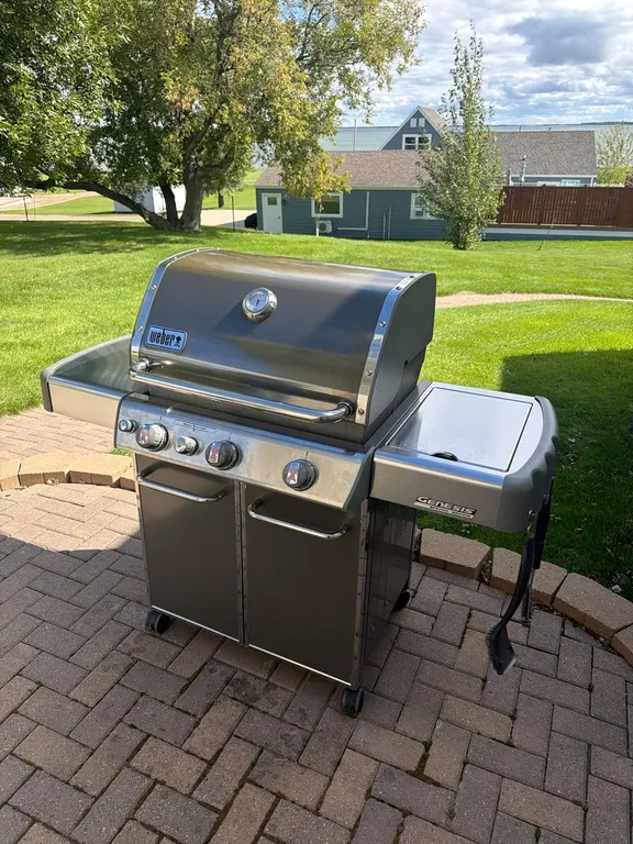 Weber Genesis grill, side burner, includes tank, excellent condition, this one sells new for over $1,100