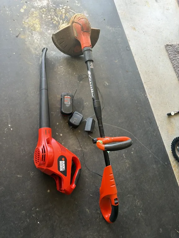 Cordless Grass Hog Black and Decker trimmer, blower, includes one battery, with charger