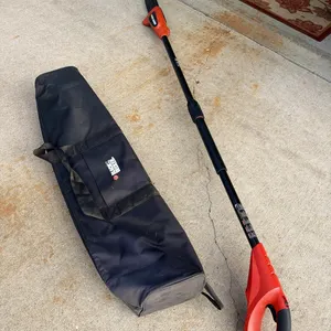 Black and Decker pole saw, cordless, includes battery and charger, works great, with bag