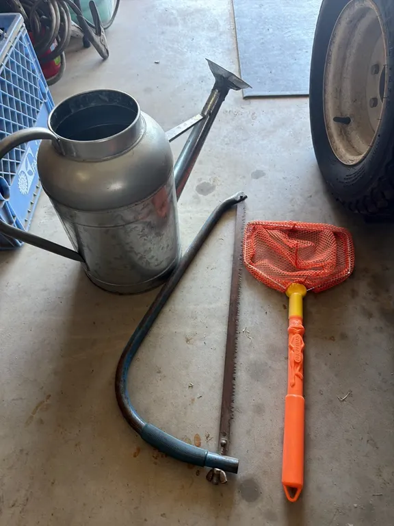 Watering can, minnow net, limb saw
