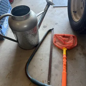 Watering can, minnow net, limb saw