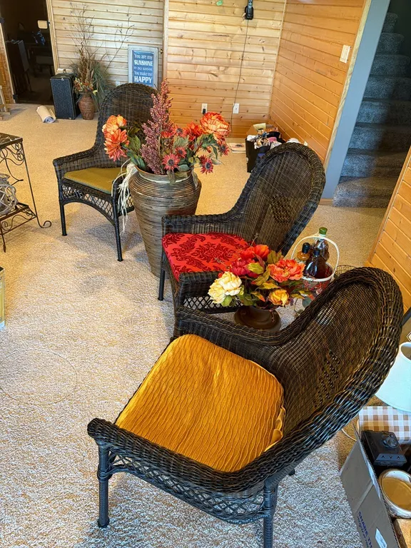 Three matching wicker chairs, two large vases with flowers. (sells all together)