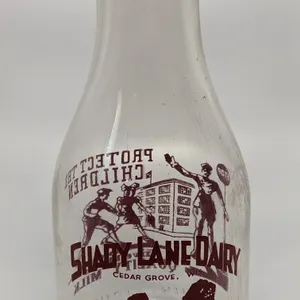 TRPQ QUART MILK BOTTLE SHADY LANE DAIRY CEDAR GROVE WISCONSIN (CROSSING GUARD)