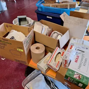 Assorted Paper Product On and Under Table