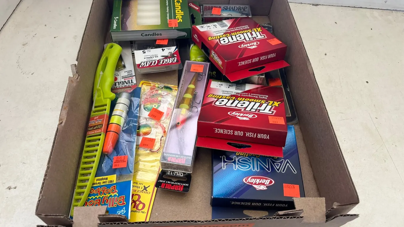 Assortment of Fishing Lures, Lines, and Candles