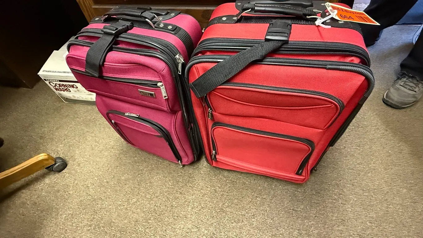 (2) Suitcases on Wheels, Red and Purple