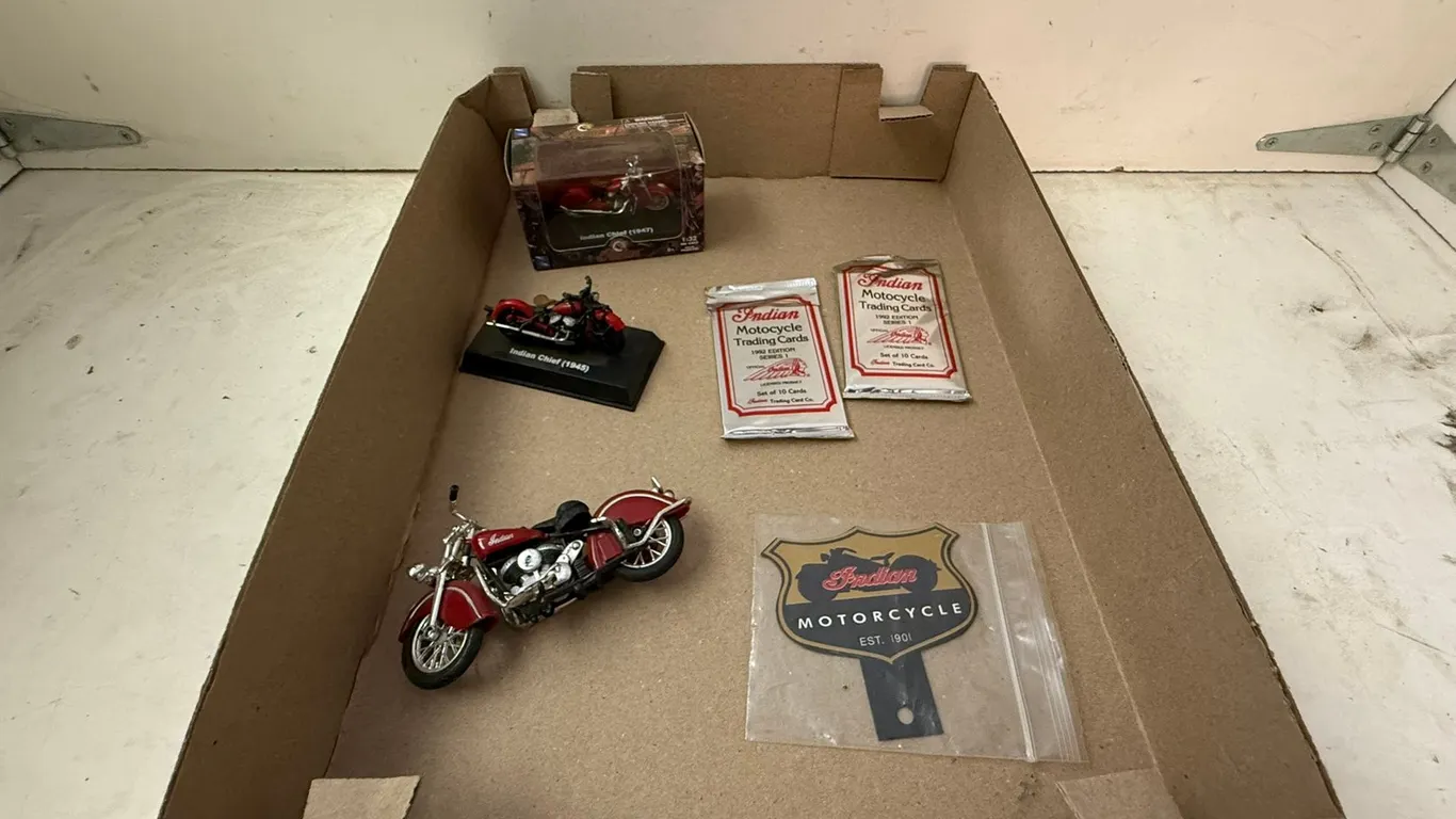 (3) Motorcycle Toy Replicas, (2) Pack of Motorcycle Trading Cards, and Motorcycle Sign