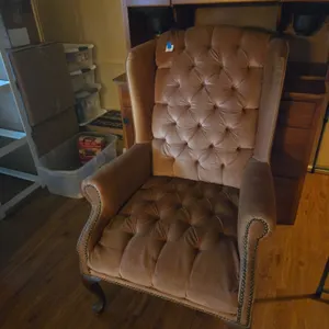 Upholstered wingback armchair