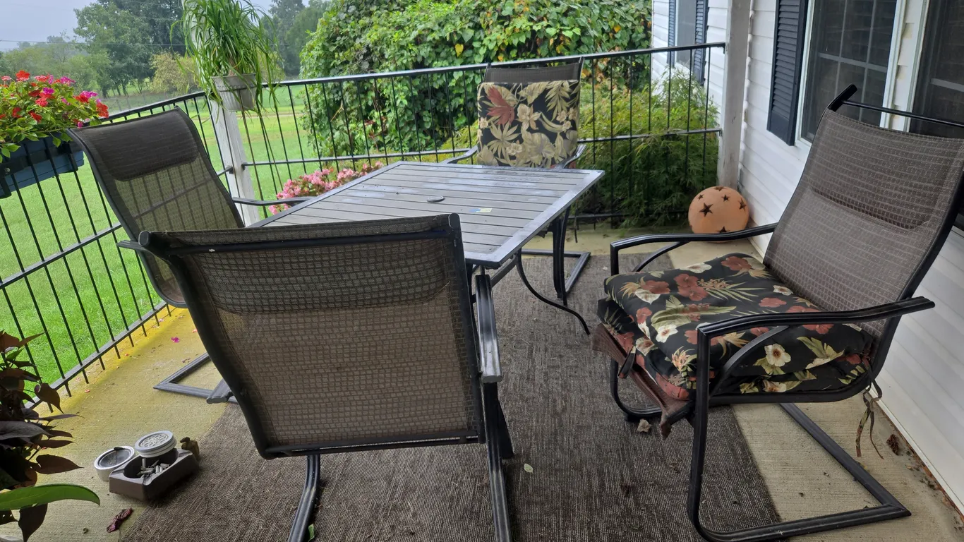 Steel patio table and four chair set