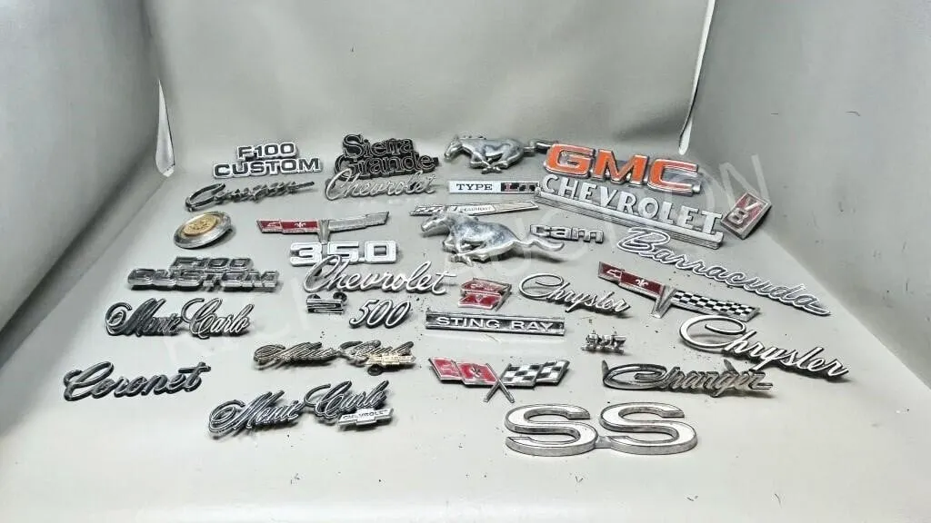 collection of vintage car emblems, & badges