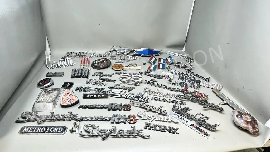 collection of vintage car emblems, & badges